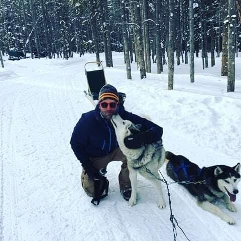 Dog sledding with huskies in the snow